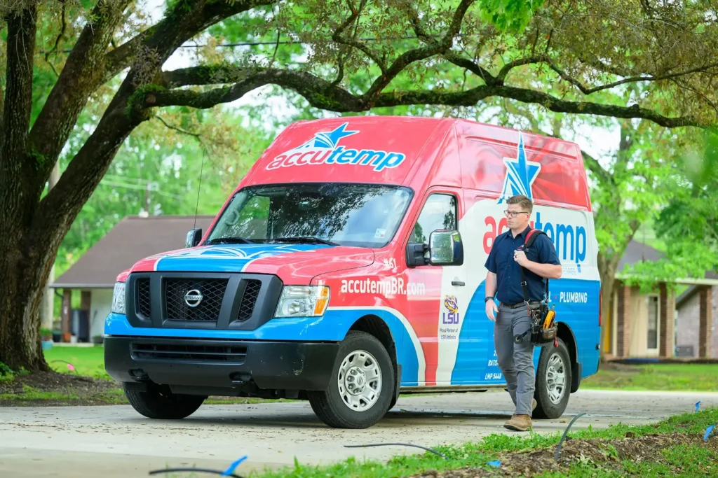 AccuTemp Team Member Standing Near a Service Truck